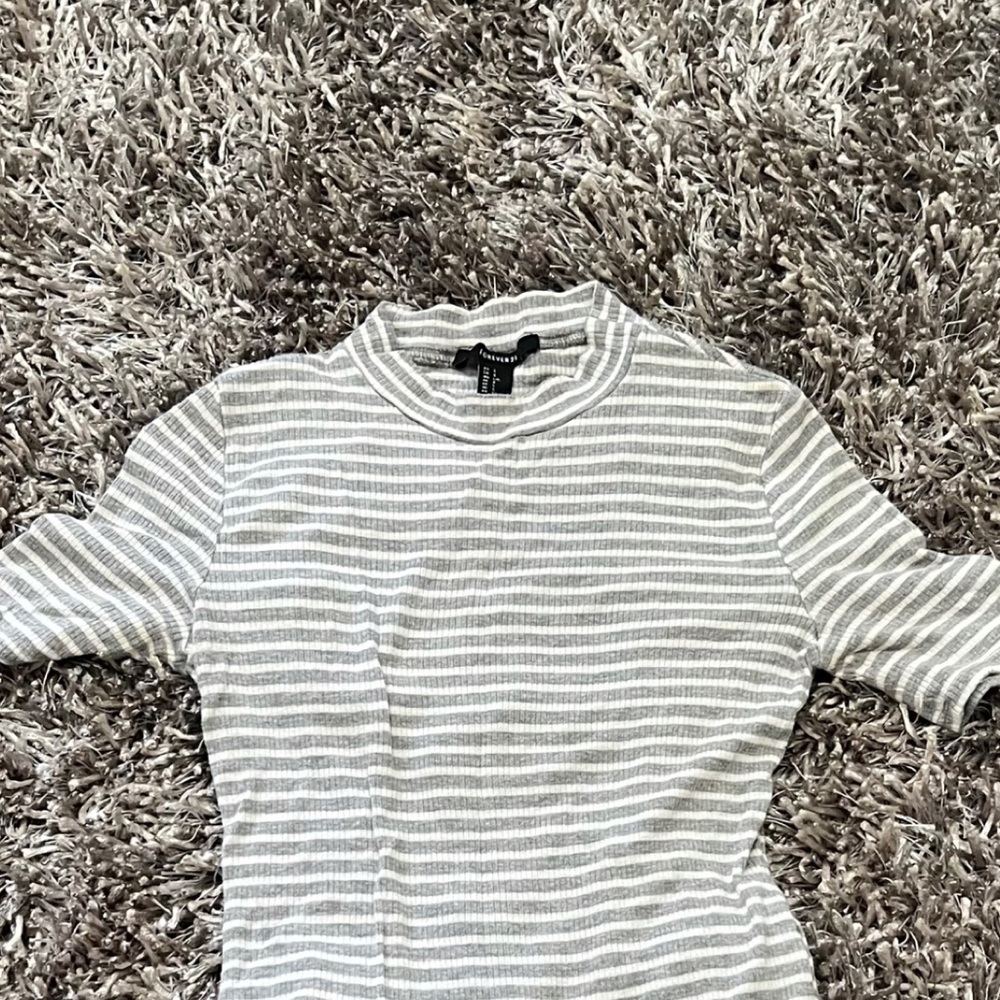 Grey and white striped body suit.